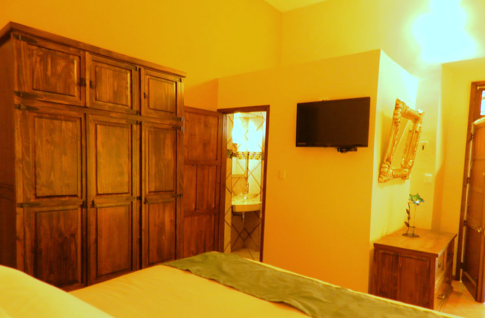 Collection O Al Otro Lado Del Rio, Puebla Hotel Bagian luar foto A room at the hotel