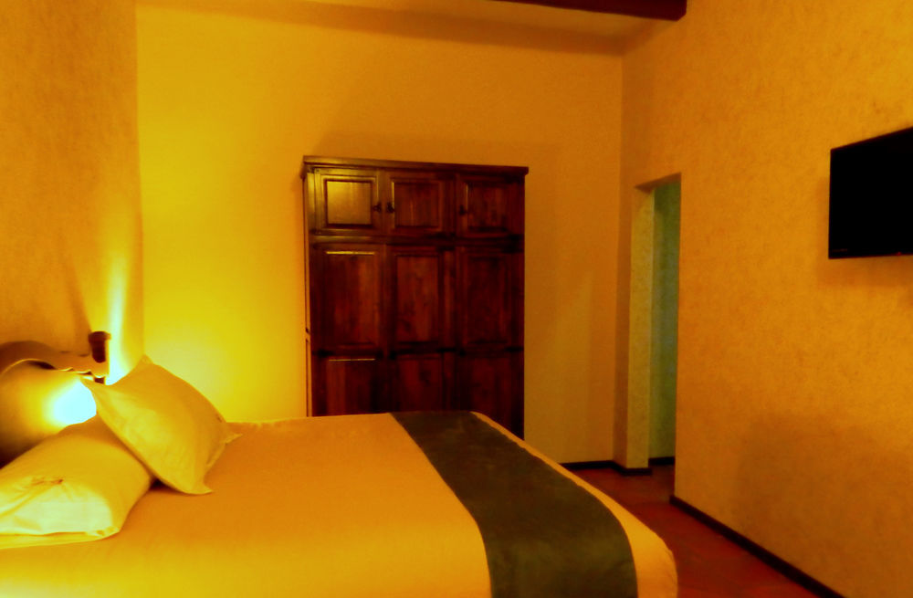 Collection O Al Otro Lado Del Rio, Puebla Hotel Bagian luar foto A room at the hotel