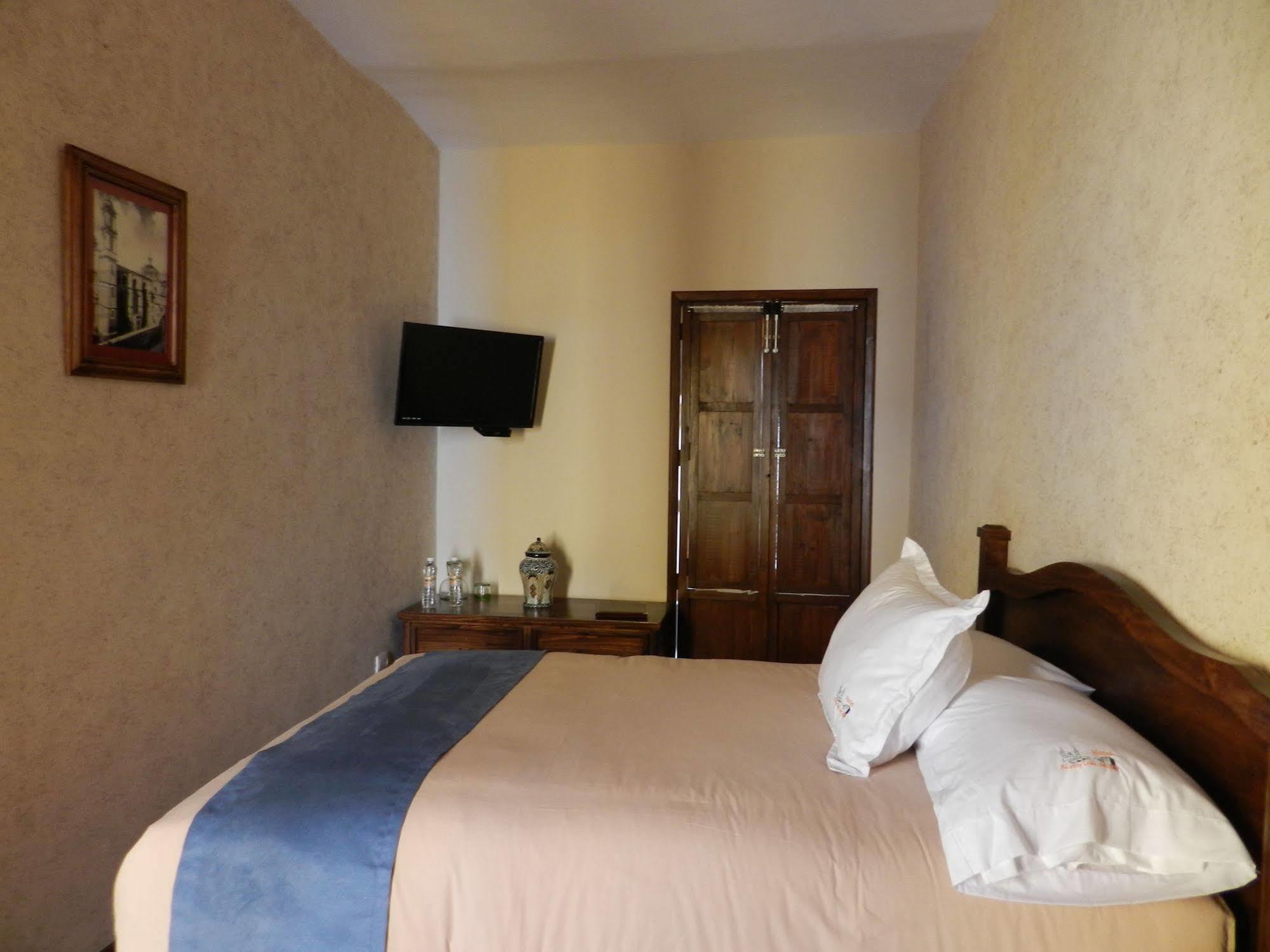 Collection O Al Otro Lado Del Rio, Puebla Hotel Bagian luar foto A room at the hotel