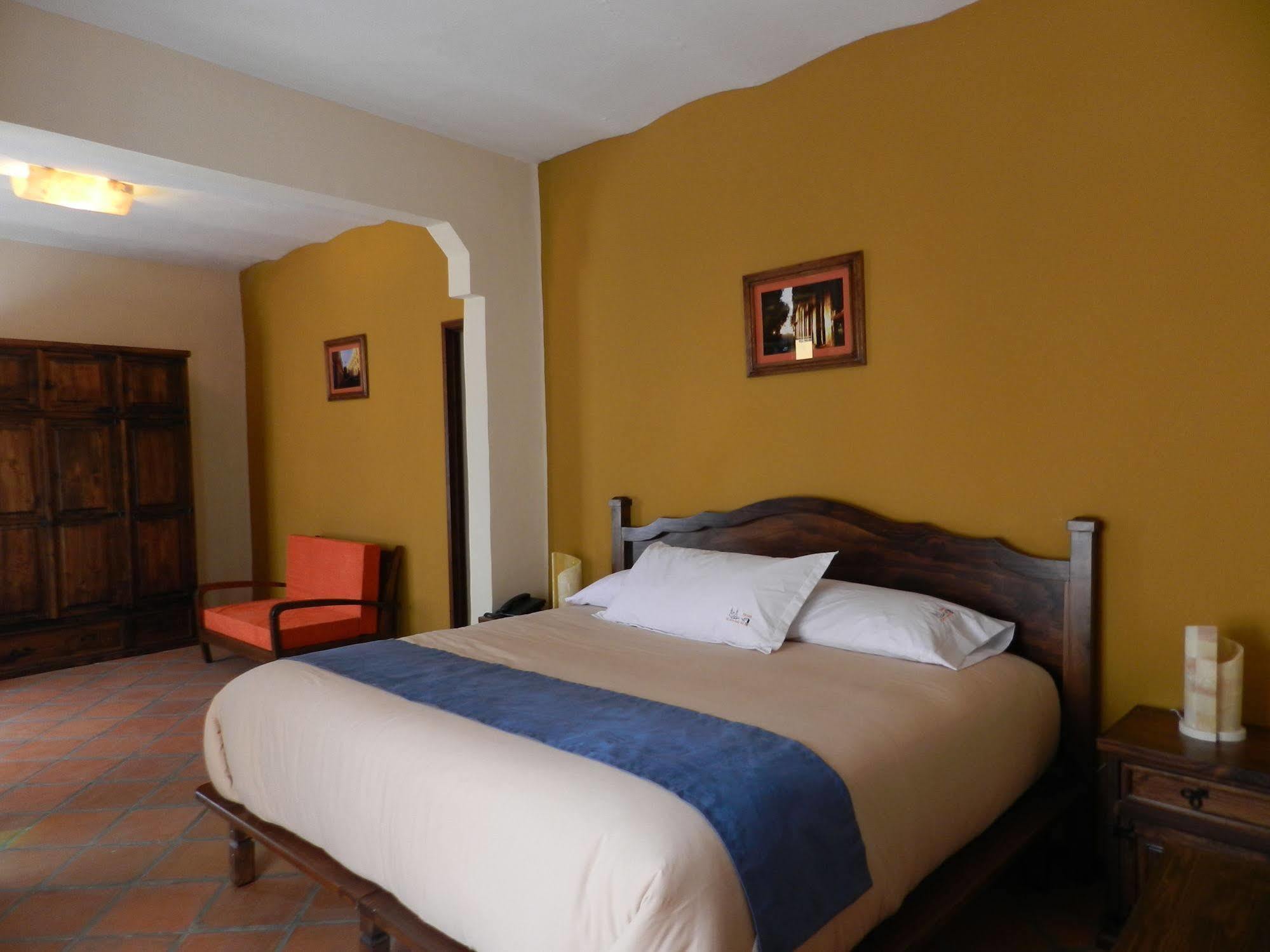 Collection O Al Otro Lado Del Rio, Puebla Hotel Bagian luar foto A bedroom at the hotel