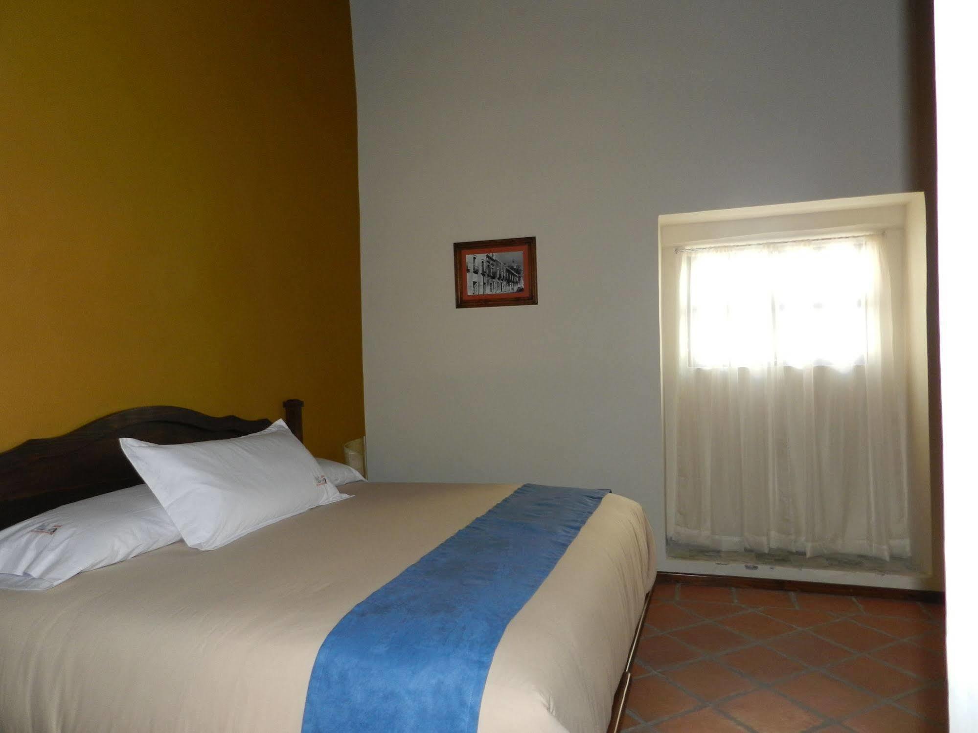 Collection O Al Otro Lado Del Rio, Puebla Hotel Bagian luar foto A room at the hotel