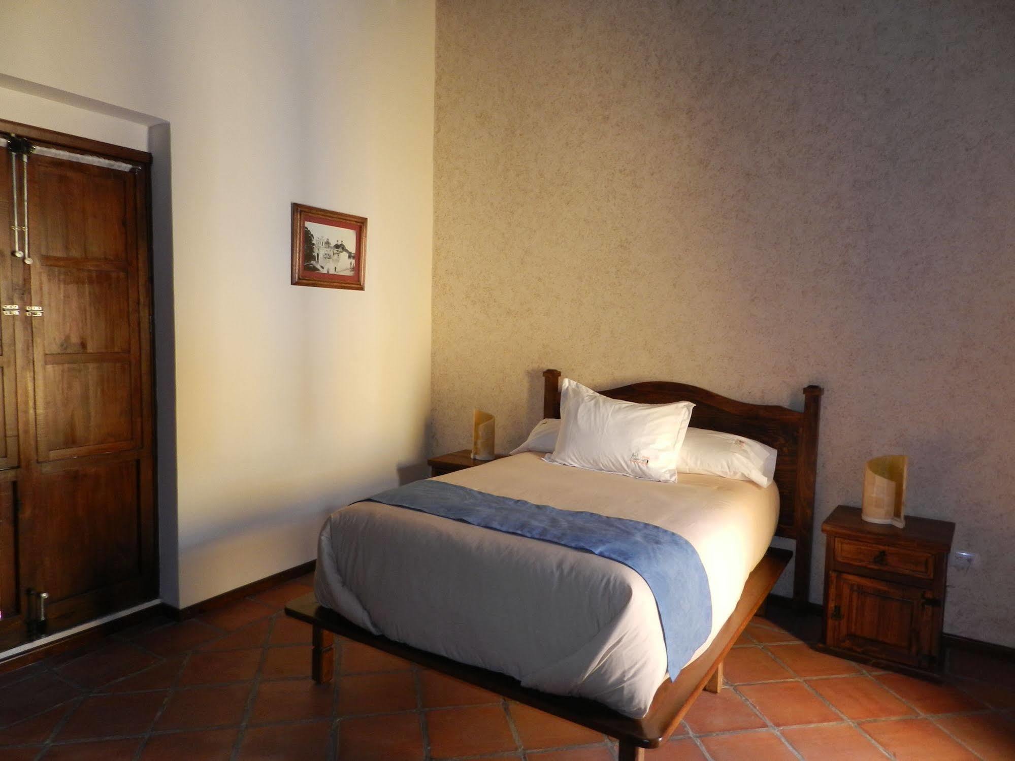 Collection O Al Otro Lado Del Rio, Puebla Hotel Bagian luar foto A room at the hotel