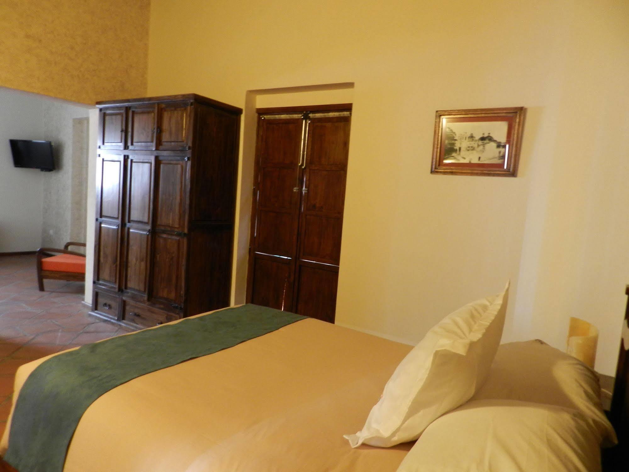 Collection O Al Otro Lado Del Rio, Puebla Hotel Bagian luar foto A room at the hotel