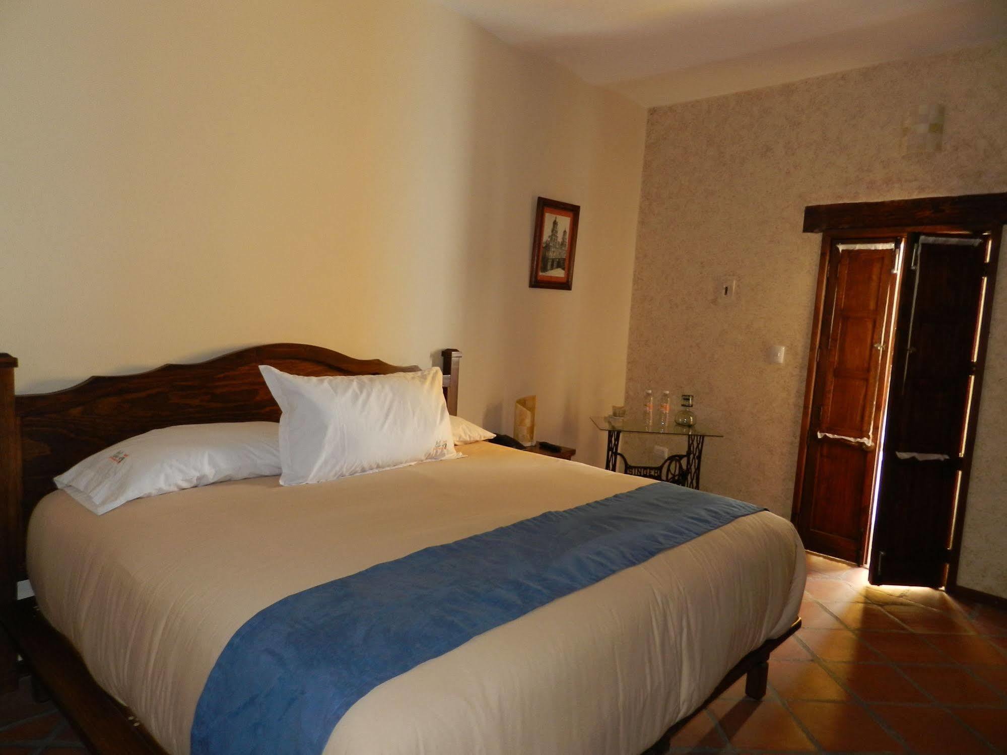 Collection O Al Otro Lado Del Rio, Puebla Hotel Bagian luar foto A bedroom at the hotel